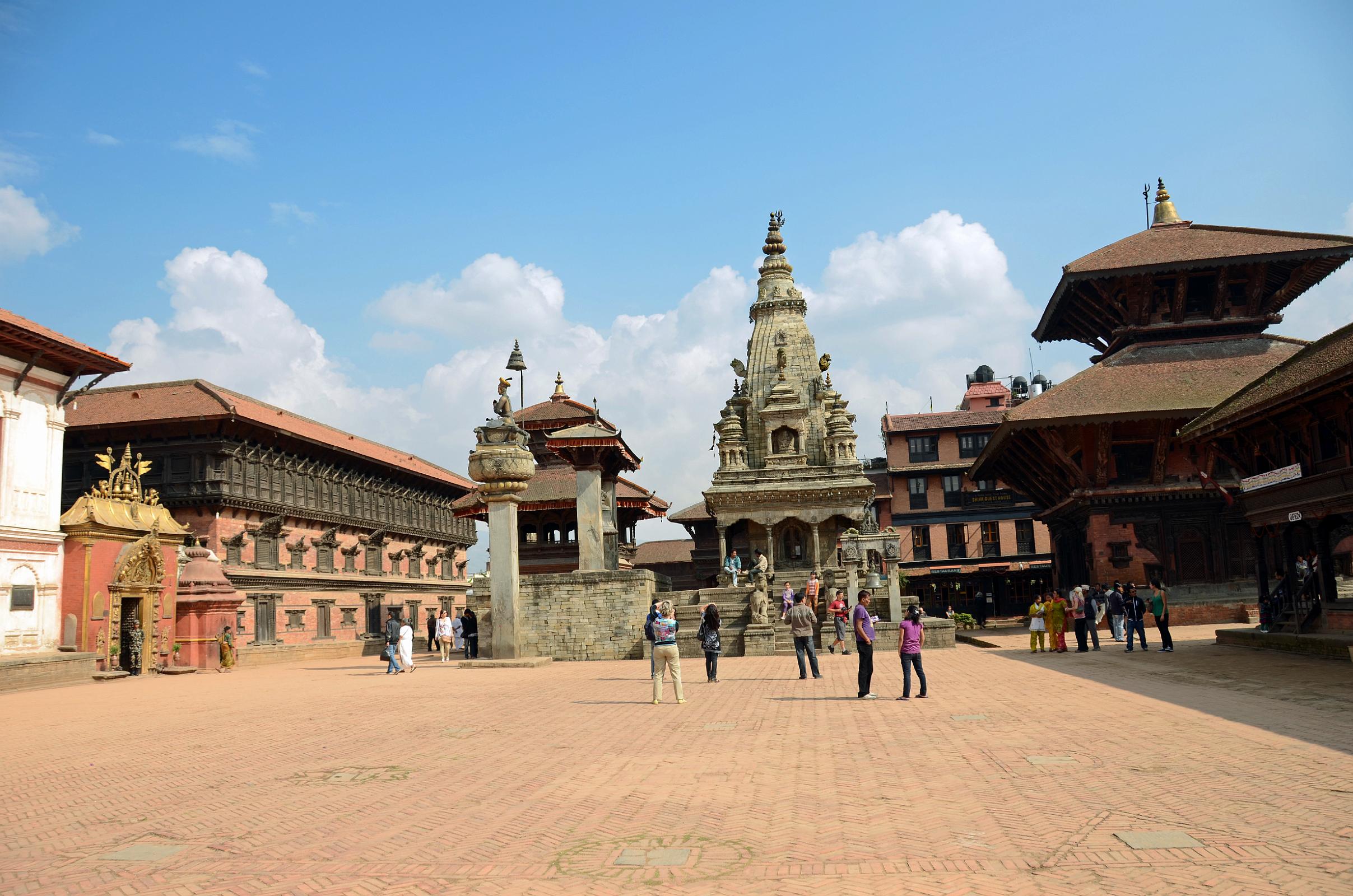 Kathmandu Bhaktapur 01-2 Bhaktapur Durbar Square With Golden Gate and Palace of 55 Windows on Left, King Bhupatindra Malla Column, Teleju Bell, Vatsala Durga Temple In Middle, Pashupatinath Temple On Right 